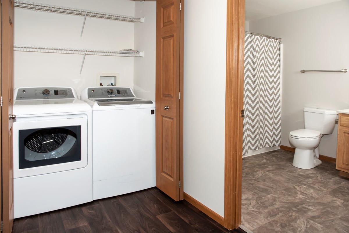 In-home washer and dryer beside the bathroom