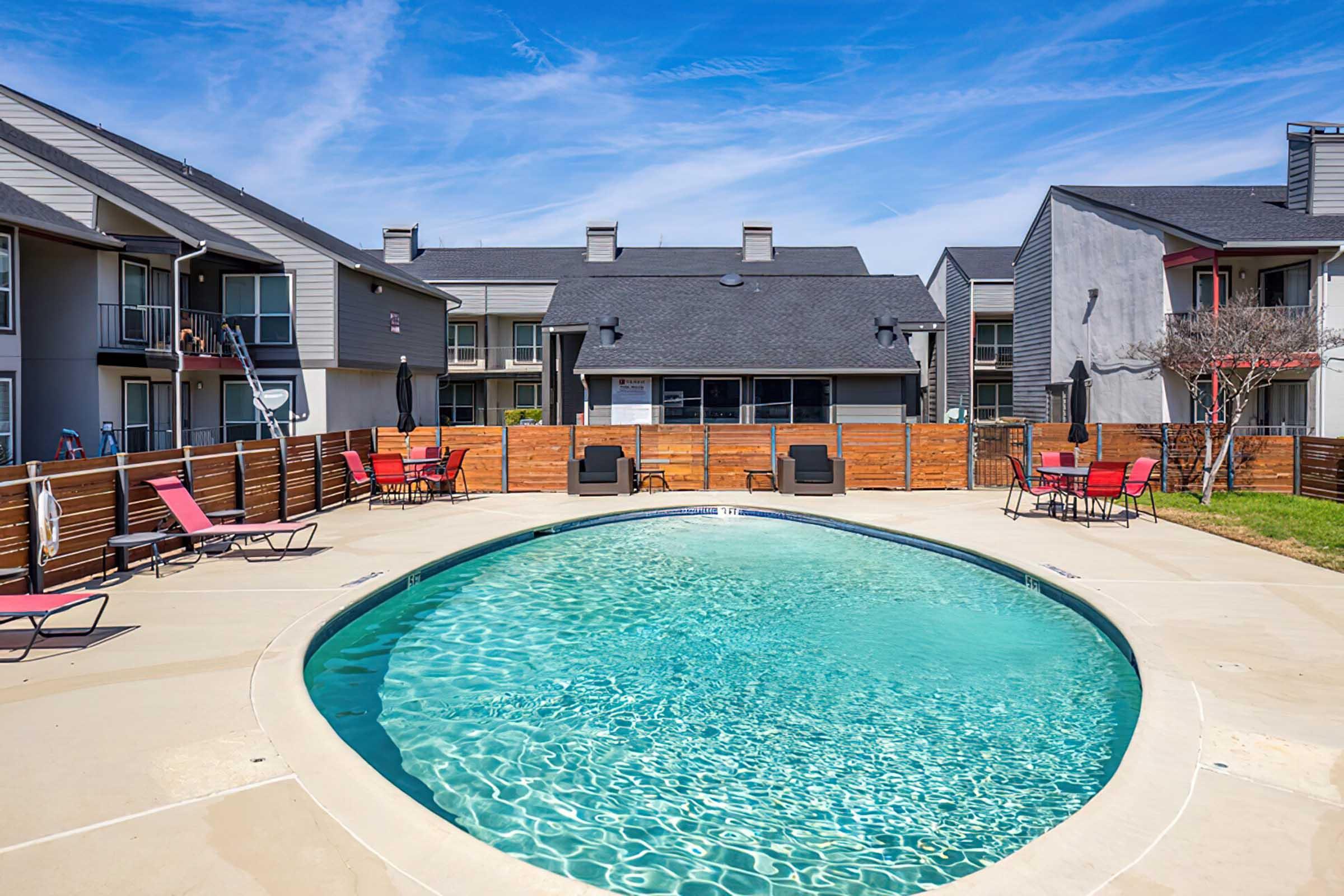 District at Midtown pool surrounded by apartments and seating.