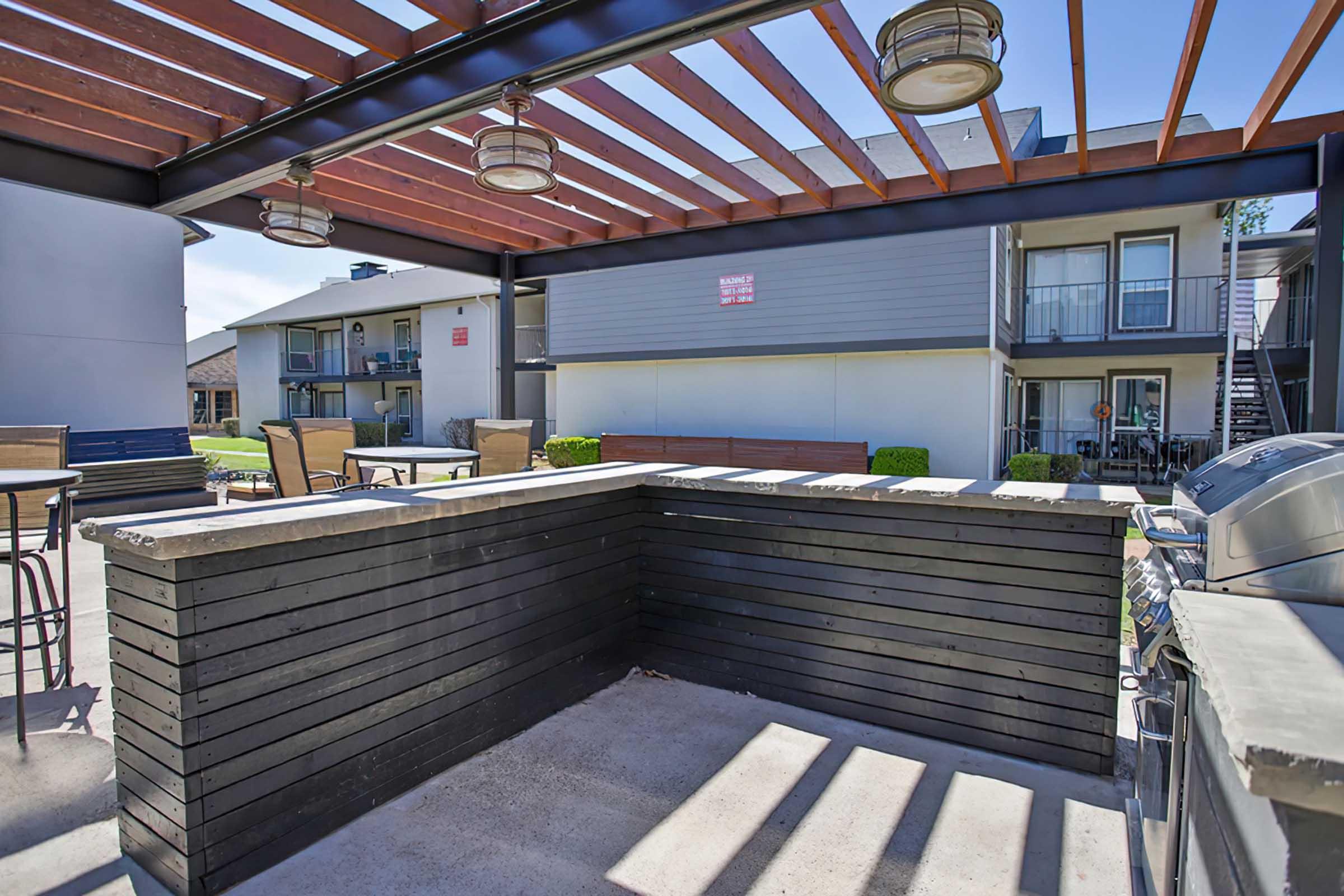 Covered outdoor kitchen and seating at District at Midtown.