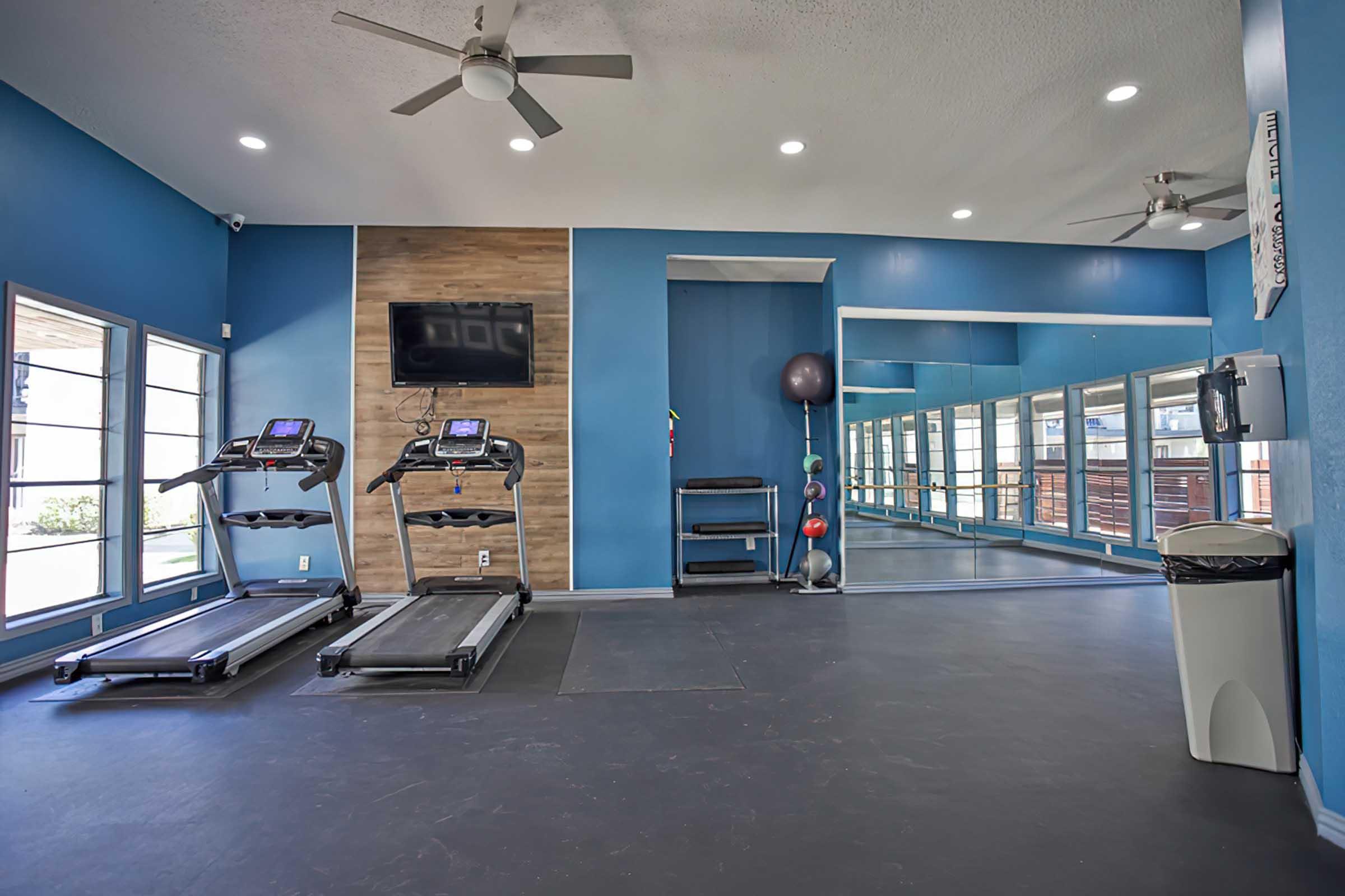 District at Midtown fitness center with treadmills and exercise equipment.