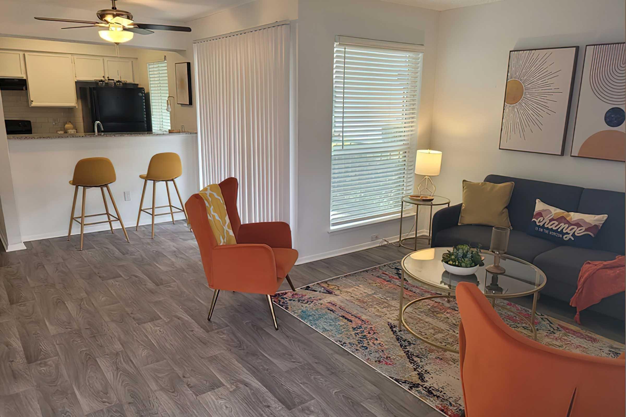 District at Midtown model living room opening toward the kitchen.