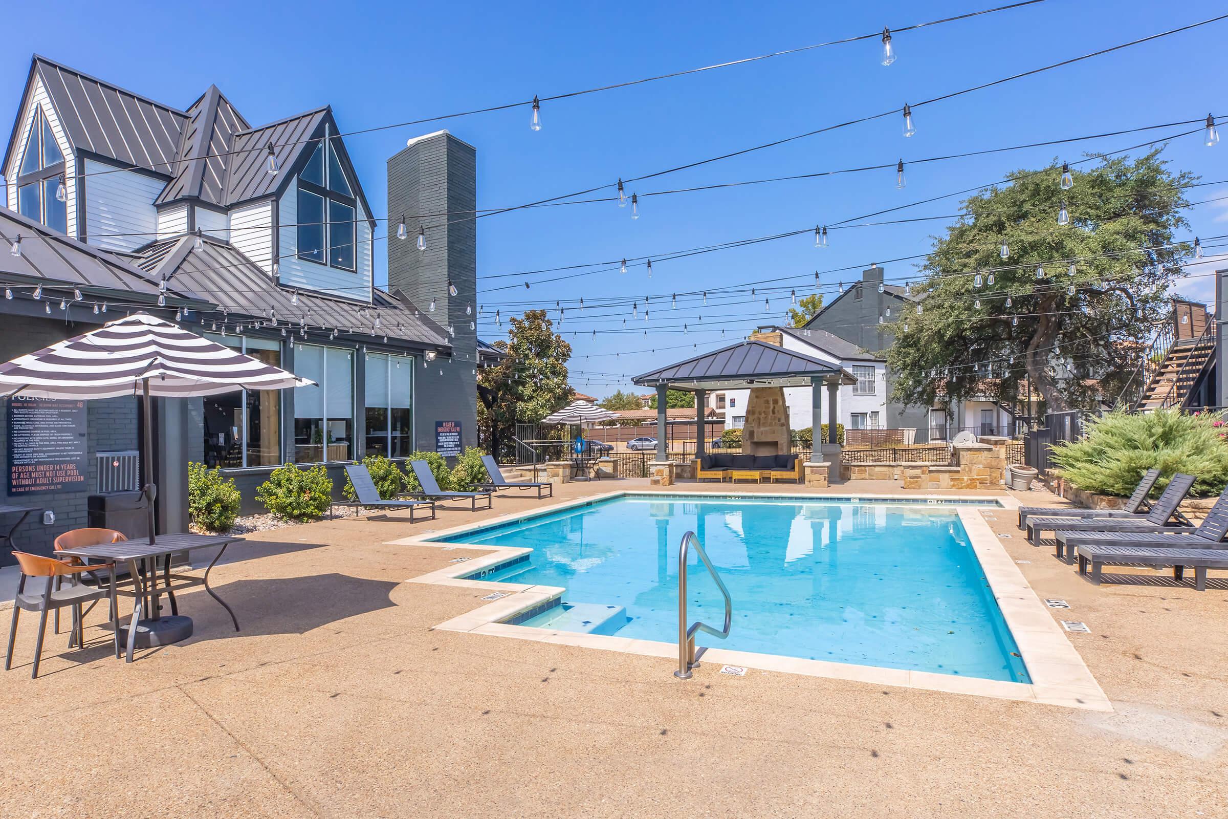 Winston swimming pool with lounge seating