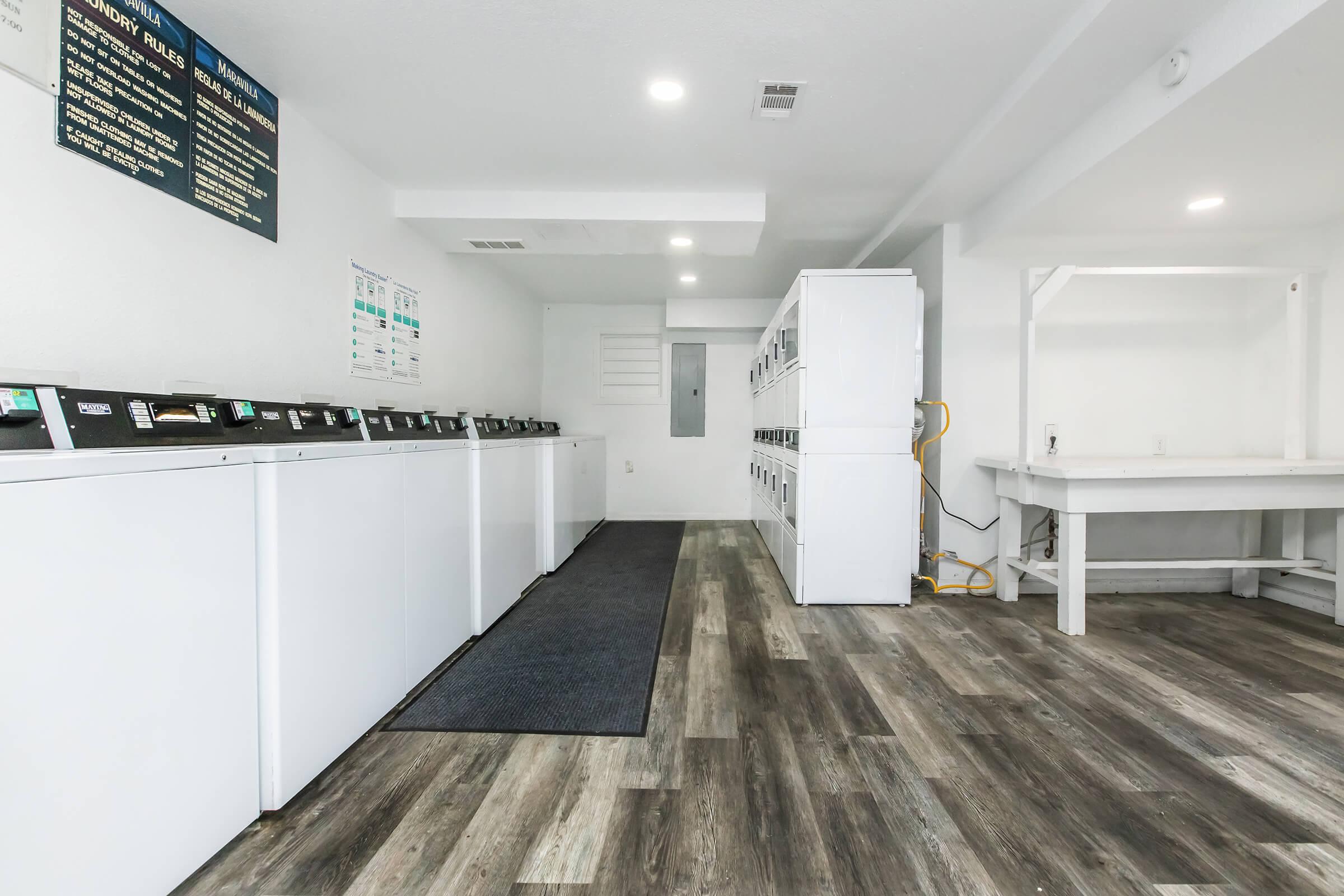 Maravilla community laundry room with washers and dryers.