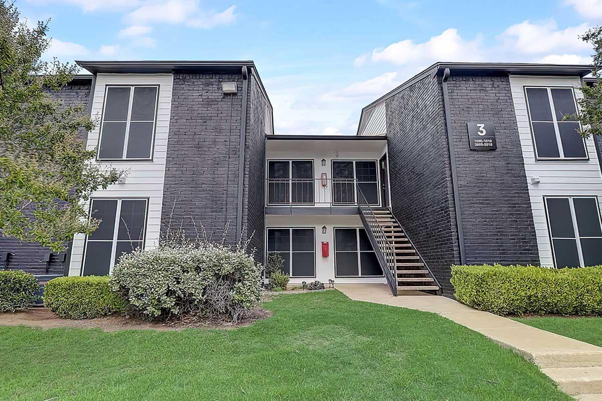 Morrison apartment building exterior with lawn and mature trees