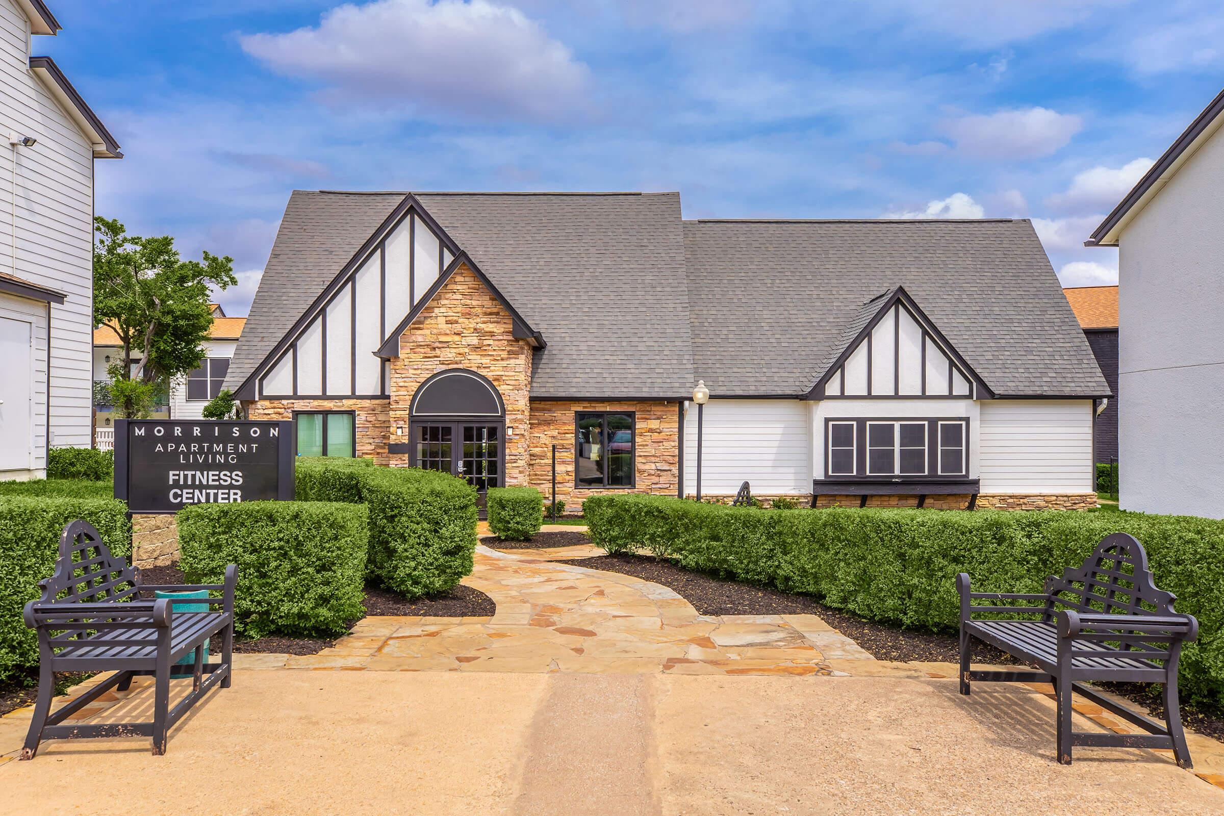 Community building exterior and landscaped walkway
