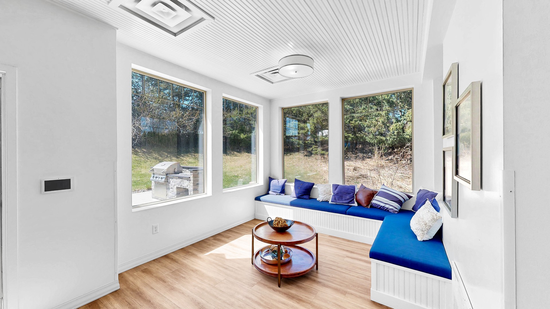 Waterstone Place clubhouse window seating with cushions and a coffee table.